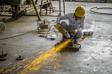 man using angle grinder
